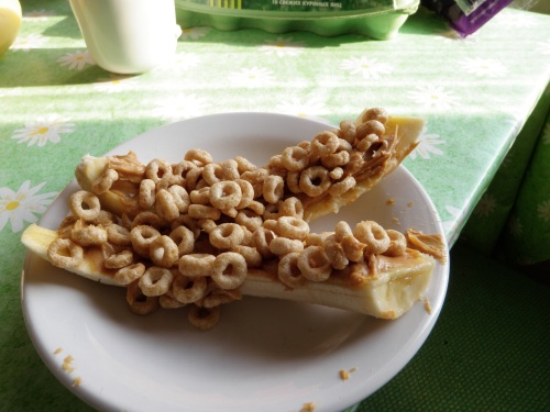 halved banana with pb and h-nut cheerios